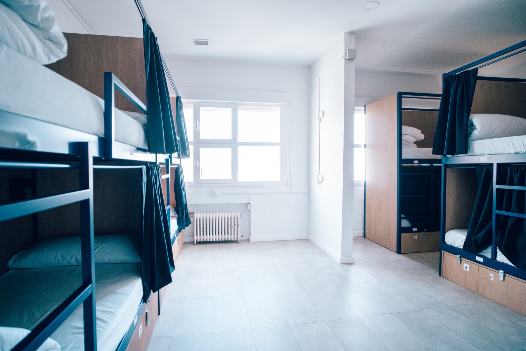 Shared room with bunk beds and privacy curtains